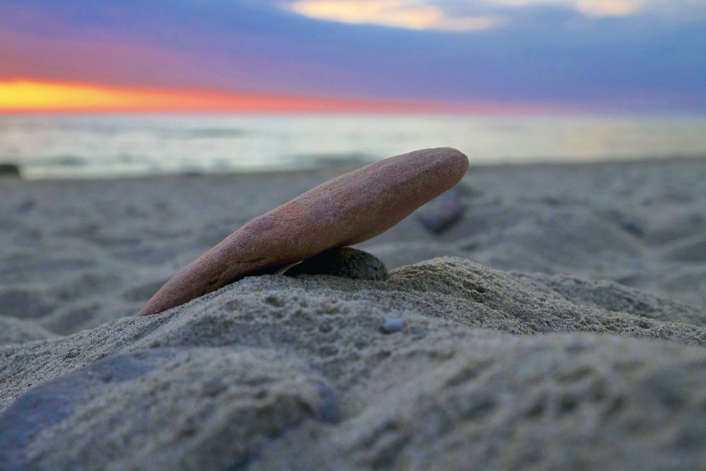 Red Stone in the Beach Sand