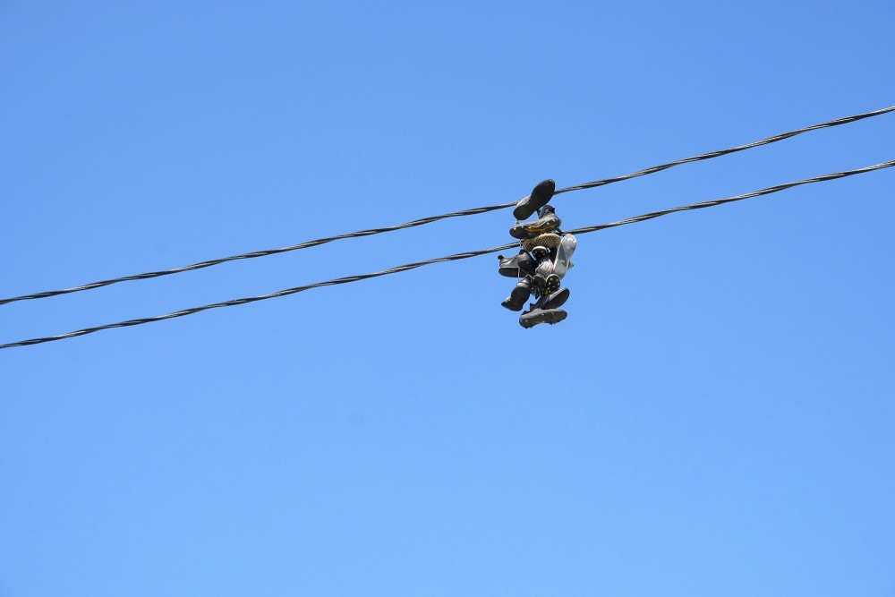 Sports Shoes on Electrical Wires