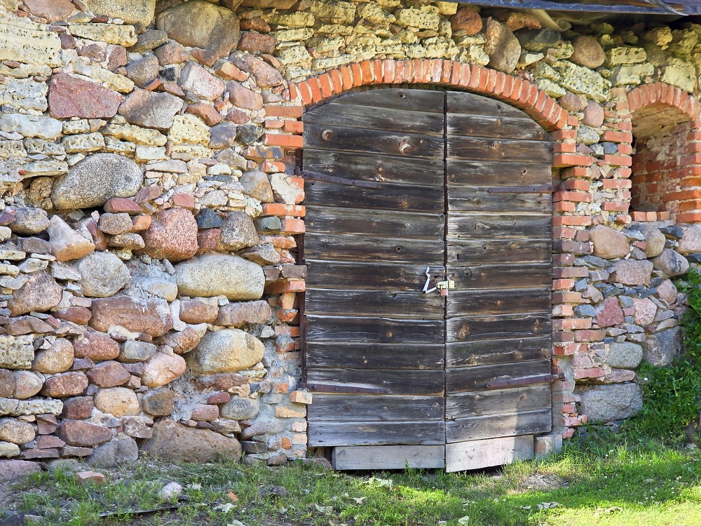 Old barn door, stone wall