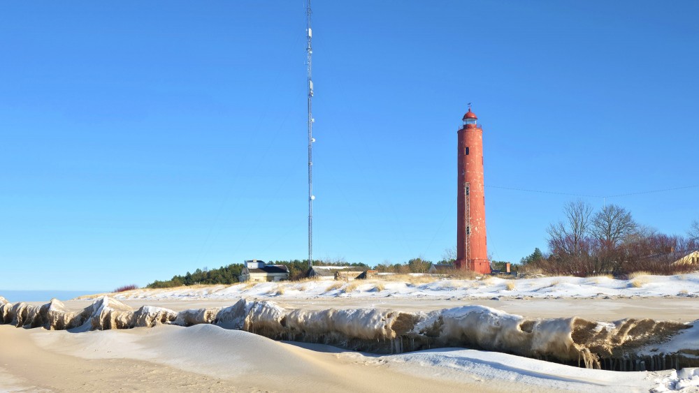 Frosted Baltic Sea coast and Akmensrags Lighthouse