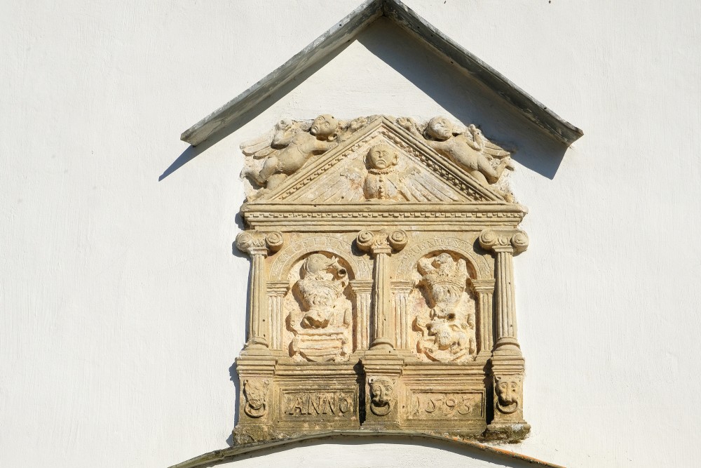 Coat of arms on the Facade of the Nereta Lutheran Church