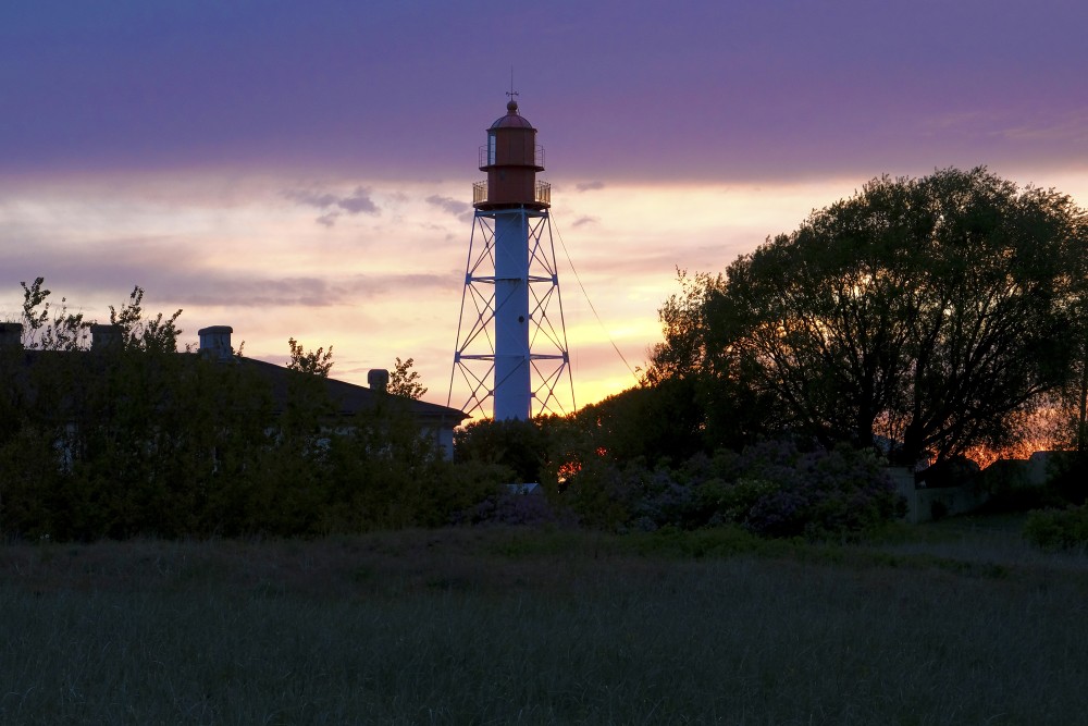 Pape Lighthouse At Sunset