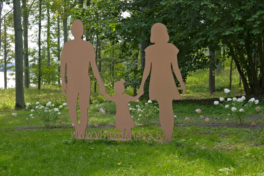 Silhouette Of Parents And Child In Koknese Park