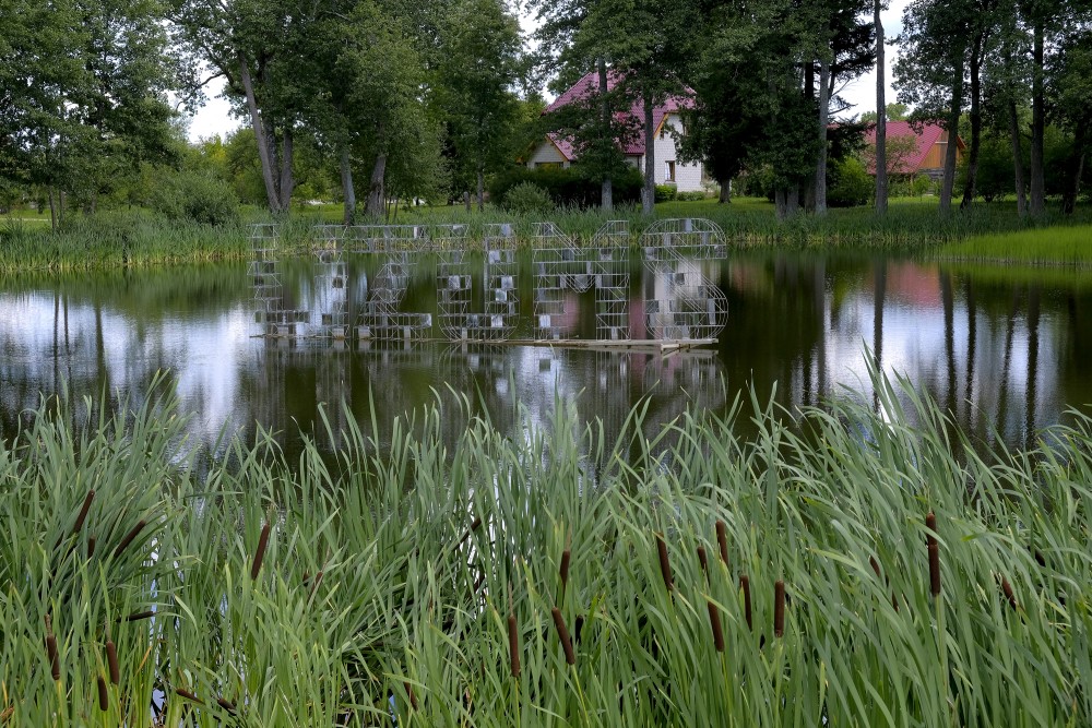 Sign "Lizums" in Lizums Pond