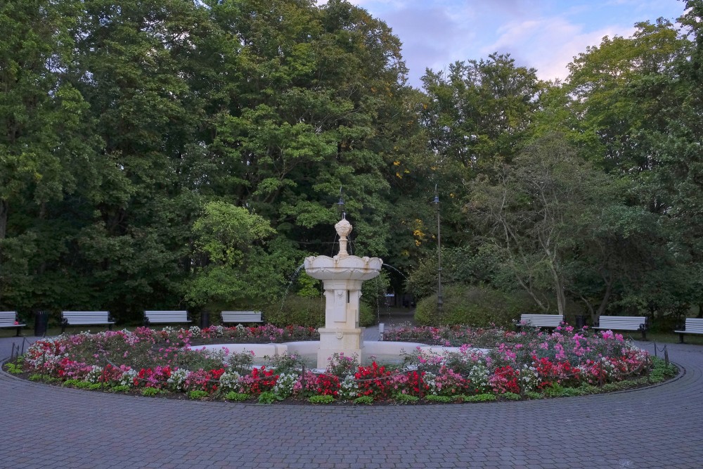 Art Nouveau fountain surrounded by flower beds in Liepaja Seaside Park