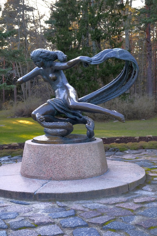 Bronze sculpture Eglė the Queen of Serpents in a park setting